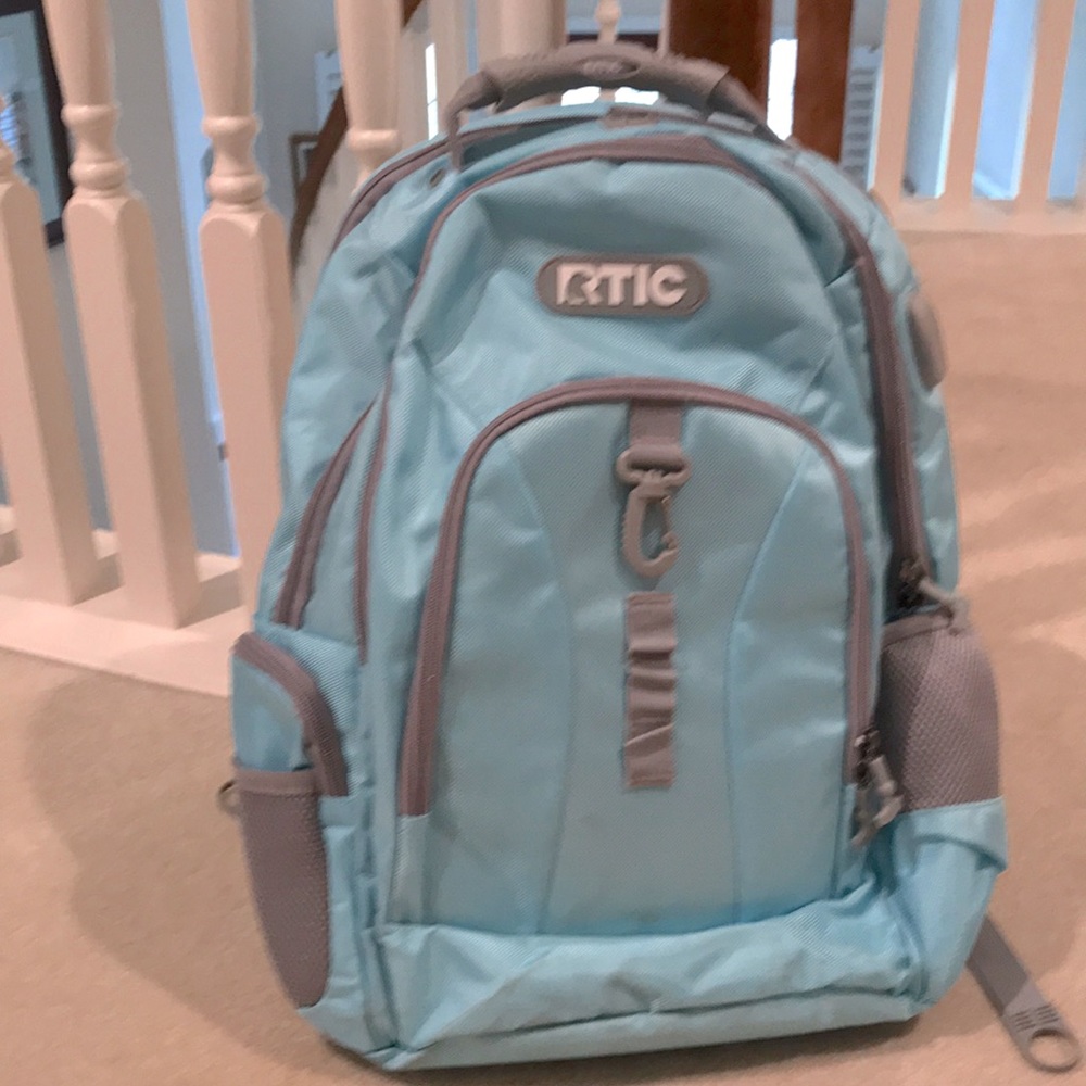 RTIC multi-pocket light blue and gray backpack